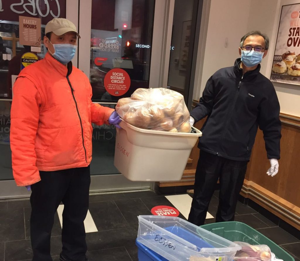 Volunteer Jun & Jason picking up bread