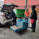 Volunteer Li unload bread at DI